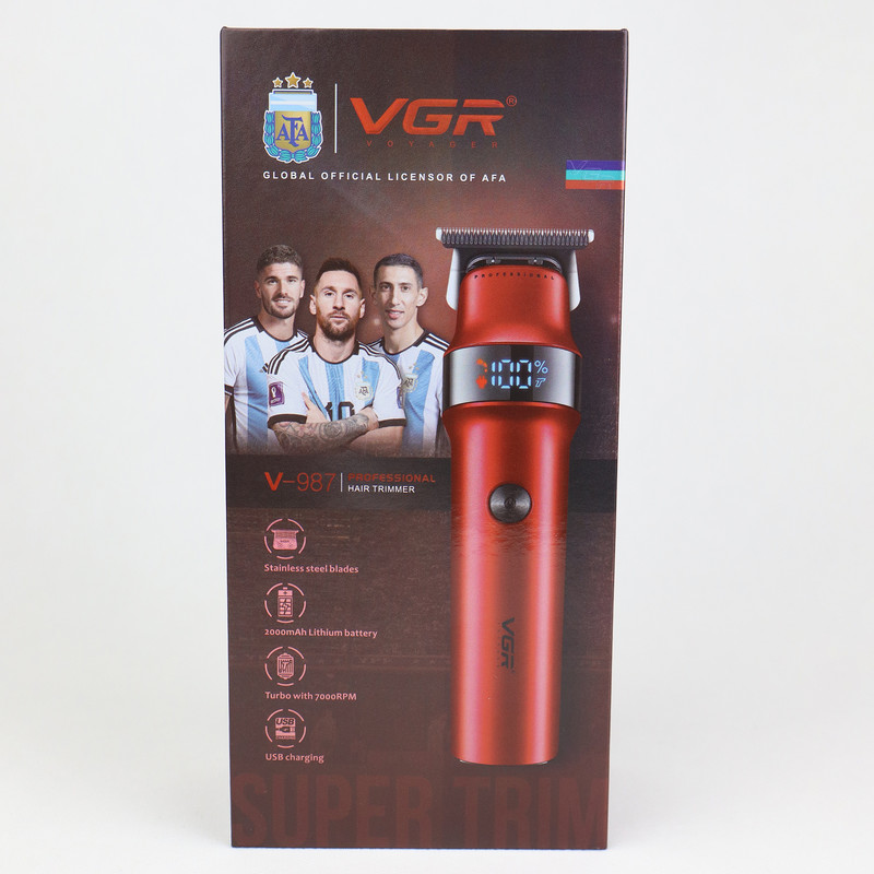 ماشین اصلاح موی سر و صورت وی جی ار مدل V-987 با تیغه استیل ضد زنگ، عملکرد توربو، قابلیت اصلاح با شماره صفر، نمایشگر میزان شارژ، طراحی ارگونومیک، همراه با سه شانه راهنما و برس تمیزکننده